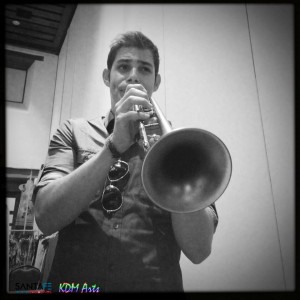 Model and Trumpet player Ryan warms up backstage at Santa Fe Fashion Week in New Mexico